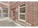 Close-up of building entrance with brick facade, glass door and sidelights, and prominent signage at 10176 Park Meadows Dr # 2403, Lone Tree, CO 80124