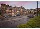 Apartment complex with brick and siding facade featuring multiple balconies and ample parking at 10176 Park Meadows Dr # 2403, Lone Tree, CO 80124