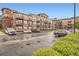 Apartment complex with brick and siding facade featuring multiple balconies and ample parking at 10176 Park Meadows Dr # 2403, Lone Tree, CO 80124