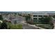 Multi-story tan and grey building with a playground and adjacent parking lot at 10176 Park Meadows Dr # 2403, Lone Tree, CO 80124