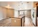 Kitchen island and stainless steel appliances with an open living area at 10176 Park Meadows Dr # 2403, Lone Tree, CO 80124