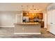 A kitchen with an island and a stainless steel refrigerator at 10176 Park Meadows Dr # 2403, Lone Tree, CO 80124