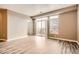 A bright living room with a sliding glass door leading to a balcony at 10176 Park Meadows Dr # 2403, Lone Tree, CO 80124