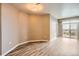 Living room with wood laminate flooring and a sliding door to the balcony at 10176 Park Meadows Dr # 2403, Lone Tree, CO 80124