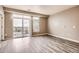 Well lit living room with a sliding glass door to a balcony at 10176 Park Meadows Dr # 2403, Lone Tree, CO 80124