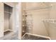 Walk-in closet featuring gray carpet and metal shelving for storage at 10176 Park Meadows Dr # 2403, Lone Tree, CO 80124
