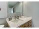 Modern bathroom with a vanity, sink, and large mirror at 1313 N Williams St # 1103, Denver, CO 80218