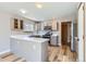 Well-lit kitchen featuring modern appliances, neutral cabinets, and a functional layout at 12144 Newport Dr, Brighton, CO 80602