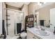Functional bathroom features a shower, vanity, and neutral tiling at 1145 S Logan St, Denver, CO 80210