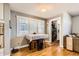 Charming breakfast nook with wooden floors, large window, seating for four, and plenty of natural light at 1145 S Logan St, Denver, CO 80210