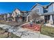 Street view of landscaped front yard, with colorful houses at 1145 S Logan St, Denver, CO 80210