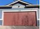 Close-up of a two car garage door featuring the house number at 1145 S Logan St, Denver, CO 80210