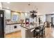 Bright kitchen featuring large island with granite countertops, stainless appliances, and pendant lighting at 1145 S Logan St, Denver, CO 80210