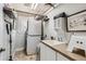 Bright laundry room with stacked washer/dryer and ample storage and counter space at 1145 S Logan St, Denver, CO 80210
