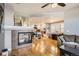 Bright living room with fireplace open to the kitchen at 1145 S Logan St, Denver, CO 80210