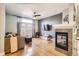 Open living room with fireplace and hardwood floors at 1145 S Logan St, Denver, CO 80210