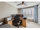 Functional office space with large desk, dual monitors, blue curtains, and natural light at 1145 S Logan St, Denver, CO 80210