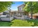 Spacious backyard with a multi-tiered deck and a hot tub for relaxation and entertainment at 9606 Whitecliff Pl, Highlands Ranch, CO 80129