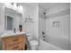 Clean bathroom features a single vanity and a shower-tub combo with tiled accents at 9606 Whitecliff Pl, Highlands Ranch, CO 80129
