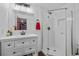 Bright bathroom featuring a glass enclosed shower and a modern vanity with ample lighting at 9606 Whitecliff Pl, Highlands Ranch, CO 80129