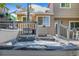 Exterior view of a backyard featuring a hot tub and deck, perfect for entertaining at 9606 Whitecliff Pl, Highlands Ranch, CO 80129