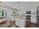 Open concept kitchen with granite counters, stainless appliances, and pendant lighting above the island at 9606 Whitecliff Pl, Highlands Ranch, CO 80129