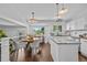 Bright kitchen featuring granite countertops, stainless steel appliances, and hardwood floors at 9606 Whitecliff Pl, Highlands Ranch, CO 80129