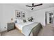 Relaxing bedroom with a modern ceiling fan, large windows, and neutral decor at 9606 Whitecliff Pl, Highlands Ranch, CO 80129