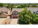 Aerial view of home with mature tree, a well-manicured lawn, and a red brick facade at 13235 Clermont Cir, Thornton, CO 80241