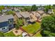 Aerial view of the property showcasing a large backyard, covered patio, and surrounding neighborhood at 13235 Clermont Cir, Thornton, CO 80241