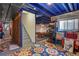 View of the basement featuring bright, colorful rug, painted blue rafters, and staircase at 13235 Clermont Cir, Thornton, CO 80241