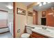 Bathroom with a vanity, sink, mirror, and view into the laundry room at 13235 Clermont Cir, Thornton, CO 80241