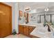 Bathroom featuring double sinks with a big mirror and white countertops at 13235 Clermont Cir, Thornton, CO 80241