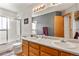 Bathroom vanity with double sinks and a shower featuring modern fixtures and neutral tones at 13235 Clermont Cir, Thornton, CO 80241