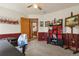 Office space featuring a dark shelving unit, neutral walls, and art displayed on the wall at 13235 Clermont Cir, Thornton, CO 80241