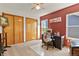 Well-lit bedroom with a desk, ample closet space, and a window offering views of the outdoors at 13235 Clermont Cir, Thornton, CO 80241