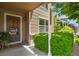 Inviting front porch with decorative plants and a view of the well-maintained neighborhood at 13235 Clermont Cir, Thornton, CO 80241