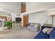 Bright and airy living room with soaring ceilings and open access to kitchen at 13235 Clermont Cir, Thornton, CO 80241
