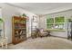 Inviting living room with carpet, a large window, and a cozy reading nook at 13235 Clermont Cir, Thornton, CO 80241