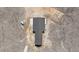 Overhead shot of a modern home, revealing its unique T-shaped roof design and surrounding natural landscape at 14550 Arfsten Rd, Larkspur, CO 80118