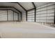 Huge metal building interior with concrete flooring and insulated walls for efficient temperature control at 14550 Arfsten Rd, Larkspur, CO 80118