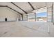 Spacious metal building interior with overhead doors and room for any project or workshop at 14550 Arfsten Rd, Larkspur, CO 80118