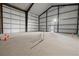 Spacious metal building interior with concrete flooring ready for customization at 14550 Arfsten Rd, Larkspur, CO 80118