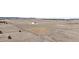 Extensive property showcasing a house with an open field; natural landscape is set against picturesque surroundings at 14550 Arfsten Rd, Larkspur, CO 80118
