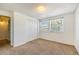Cozy bedroom featuring carpet flooring, closet space, and lots of natural light at 1545 S Ouray Cir # B, Aurora, CO 80017