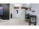 A functional basement space with a modern desk setup under stairs and a clean, minimalist aesthetic at 2560 Blake # 101, Denver, CO 80205