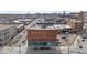 Charming brick building in a vibrant neighborhood, featuring classic architecture and a bustling city backdrop at 2560 Blake # 101, Denver, CO 80205