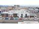Modern building featuring distinct retail spaces with a mural, nestled in a lively urban setting at 2560 Blake # 101, Denver, CO 80205