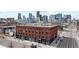Stunning city views surround this brick building, boasting modern upgrades and a prime location for urban living at 2560 Blake # 101, Denver, CO 80205