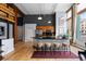 Spacious kitchen with a breakfast bar, stainless steel appliances, and wood beam accents at 2560 Blake # 101, Denver, CO 80205